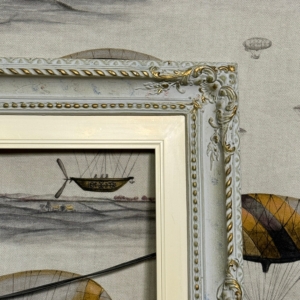 Decorative wall frame with detailed carving and soft patina