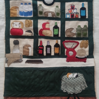 Textile artwork of pantry scene by Pili Iglesias