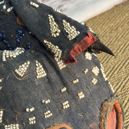 African tribal mask with glass and coral beads